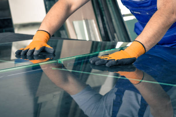 Worker Cutting Glass